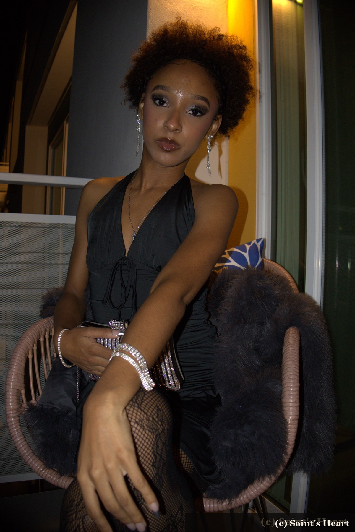 Seated evening portrait in a black dress