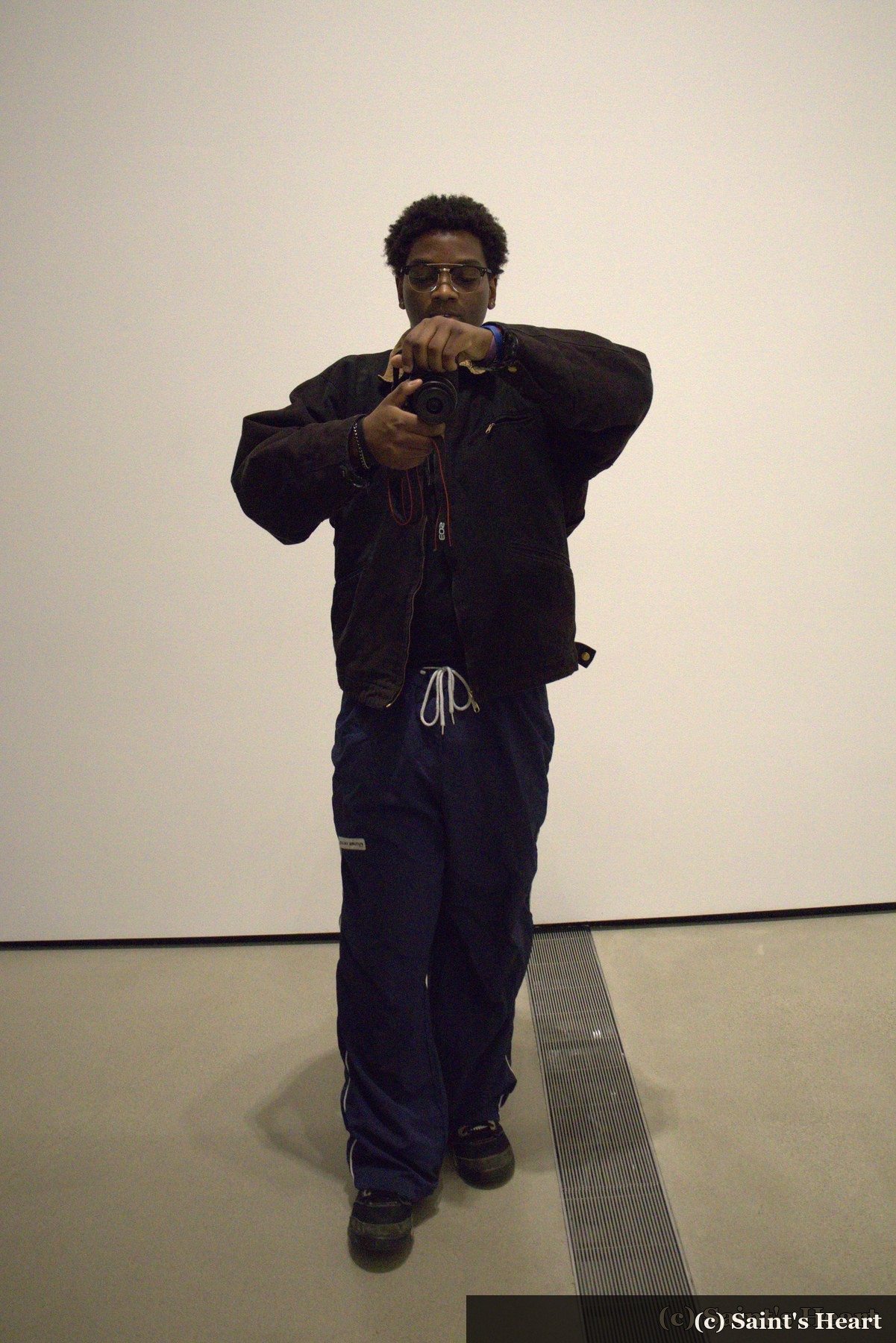 Photographer self-portrait holding a camera